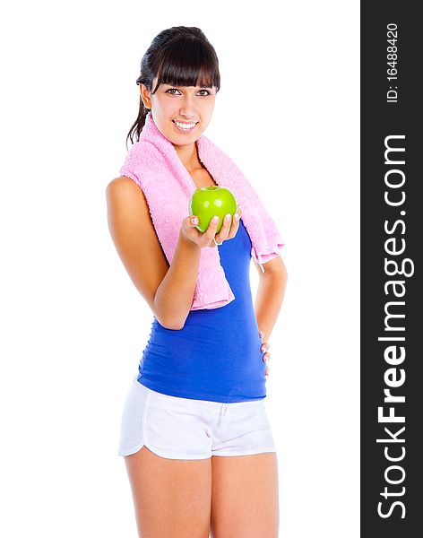 Young woman with green apple in the hand after fitness. Isolated over white