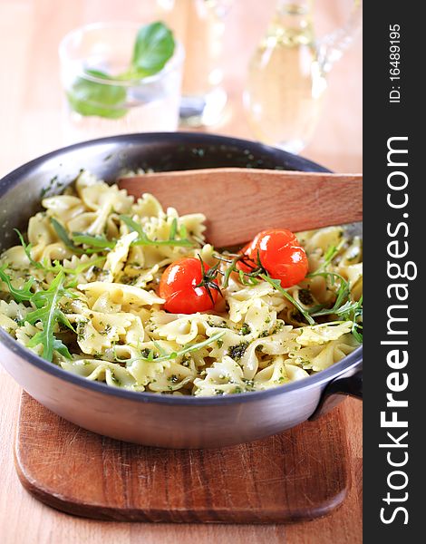 Farfalle pasta with pesto and arugula - detail