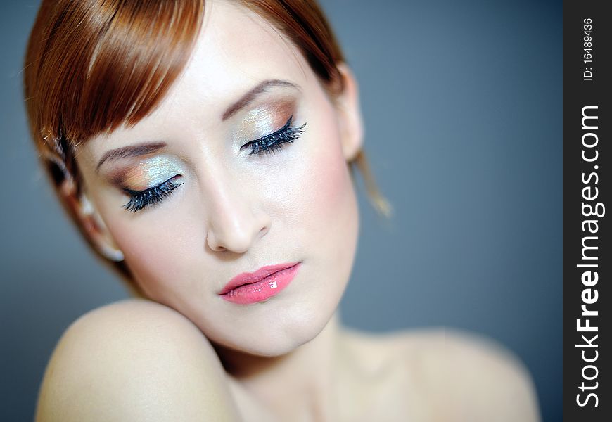 Portrait of pretty woman with pure healthy skin and natural make-up in brown tones. Portrait of pretty woman with pure healthy skin and natural make-up in brown tones