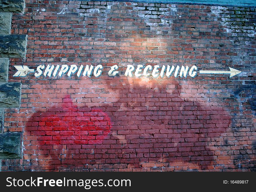 Shipping and recieving sign on an old building