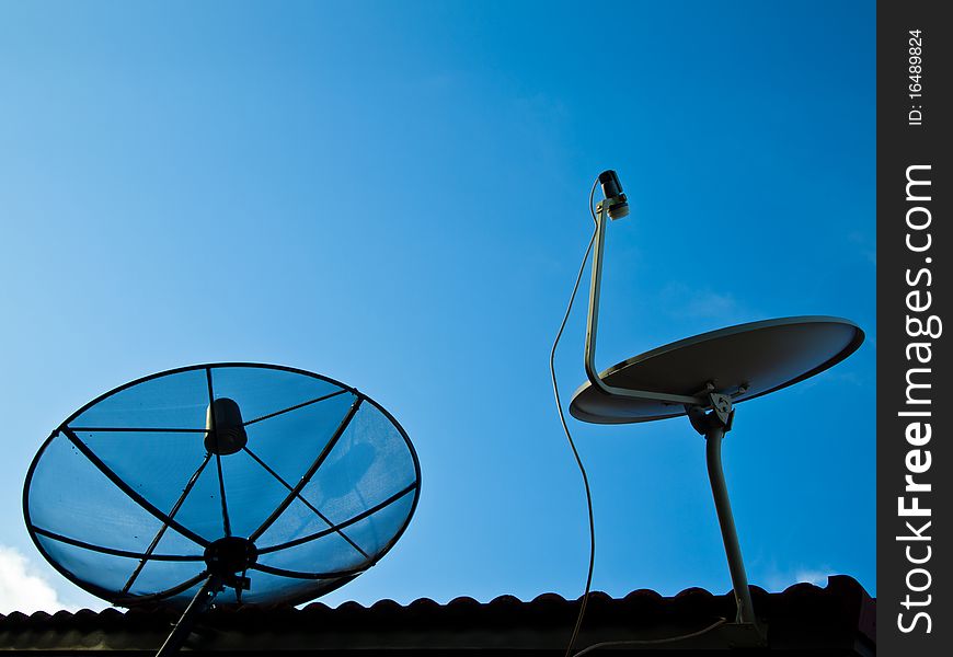 Two kinds of satellite on the roof with blue sky. Two kinds of satellite on the roof with blue sky