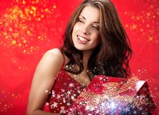 Sexy Girl Holding A Gift In Magic Packing Royalty Free Stock Photography Sexy Girl Holding A Gift In Magic Packing Royalty Free Stock Photography