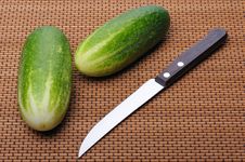 Cucumbers And Knife Royalty Free Stock Images