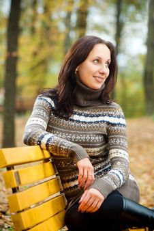 Young Woman Sitting On A Bench In Autumn Park Stock Photography Young Woman Sitting On A Bench In Autumn Park Stock Photography