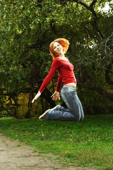 Young Girl In Red Shirt Jumping Outdoor Stock Images Young Girl In Red Shirt Jumping Outdoor Stock Images
