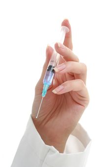 Doctor. Syringe In The Hand. Royalty Free Stock Photos Doctor. Syringe In The Hand. Royalty Free Stock Photos