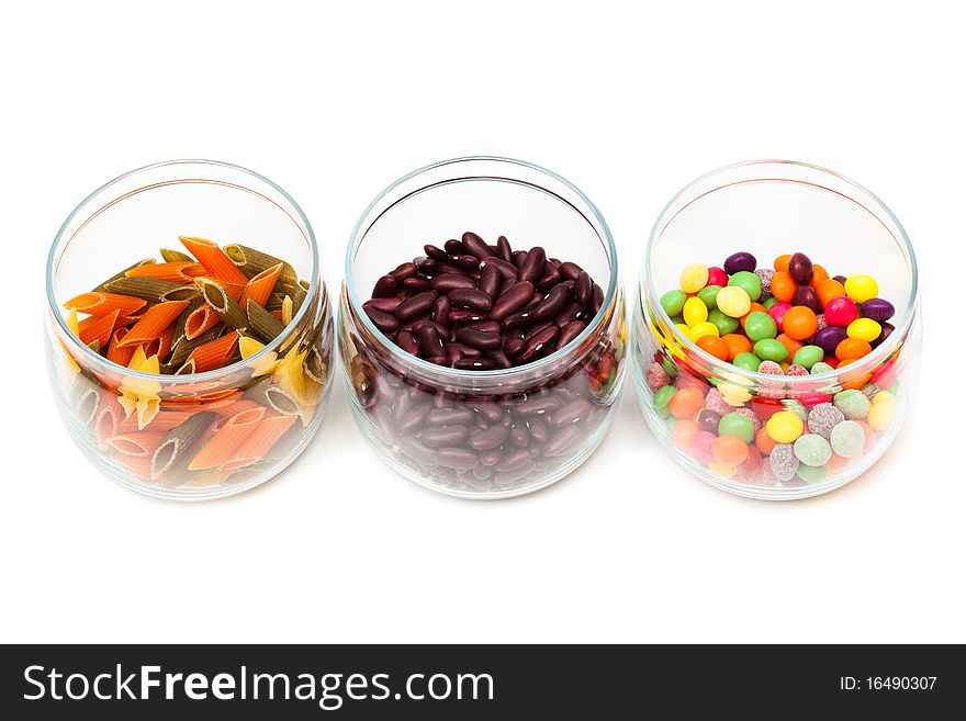 Food in glass jars on a white background