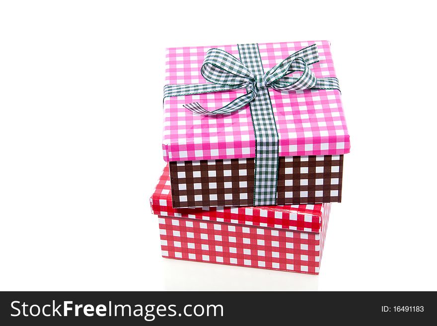 Colorful checkered giftboxes isolated on white background