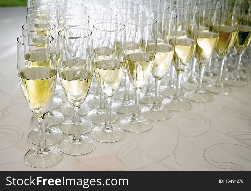 Glasses with white wine over a cocktail table