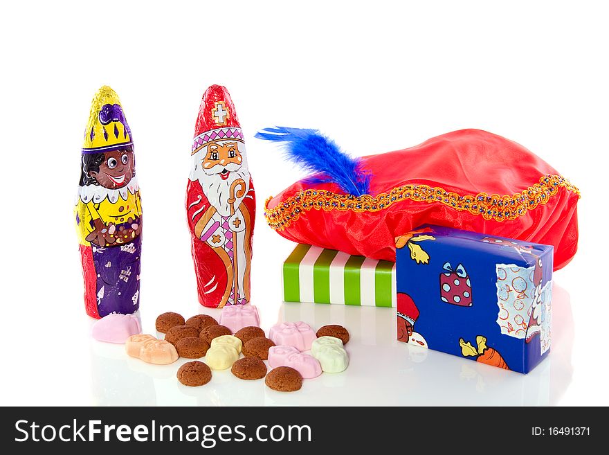 Dutch Sinterklaas celebration with gifts and candy gingernuts isolated on white background