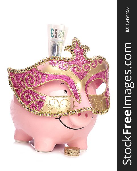 Piggy bank with masquerade party mask cutout. Piggy bank with masquerade party mask cutout