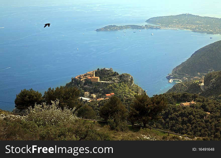 View of Eze, a medieval village of the French Riviera. On the upper right hand side of image is very famous Saint Jean Cap Ferrat, where many multi-millionnaires from all over the world, (including the richest American) have a residence. View of Eze, a medieval village of the French Riviera. On the upper right hand side of image is very famous Saint Jean Cap Ferrat, where many multi-millionnaires from all over the world, (including the richest American) have a residence.