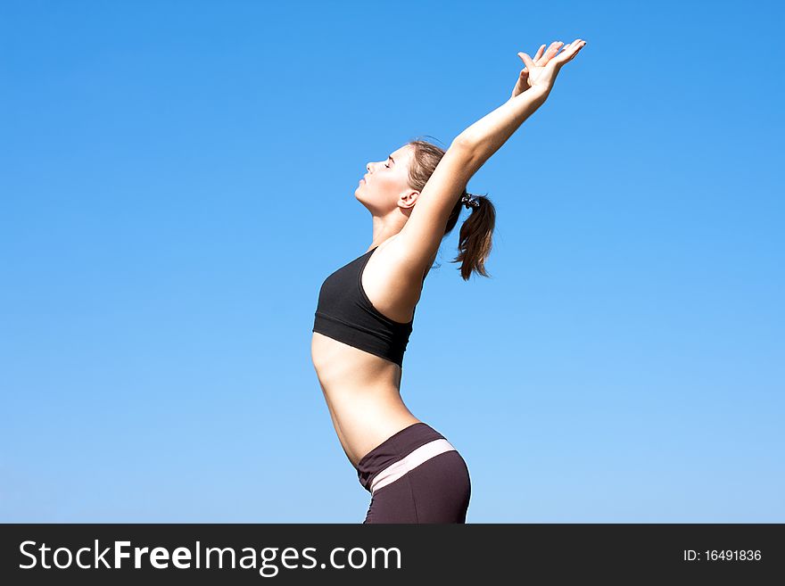 Young woman with arms outstretched