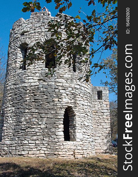 Round Stone Tower with arch window openings. Round Stone Tower with arch window openings