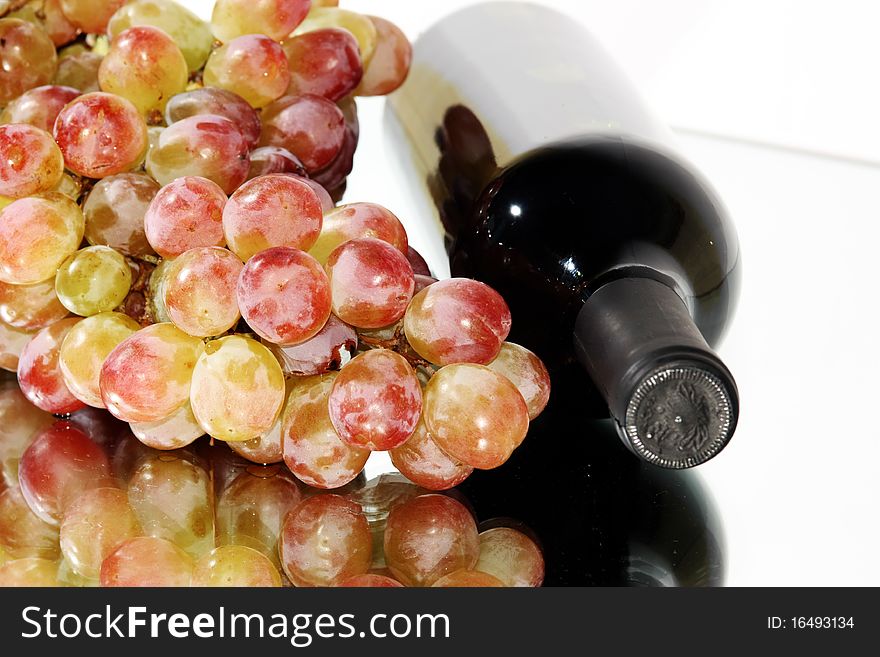 Bottle Of Wine And Grapes