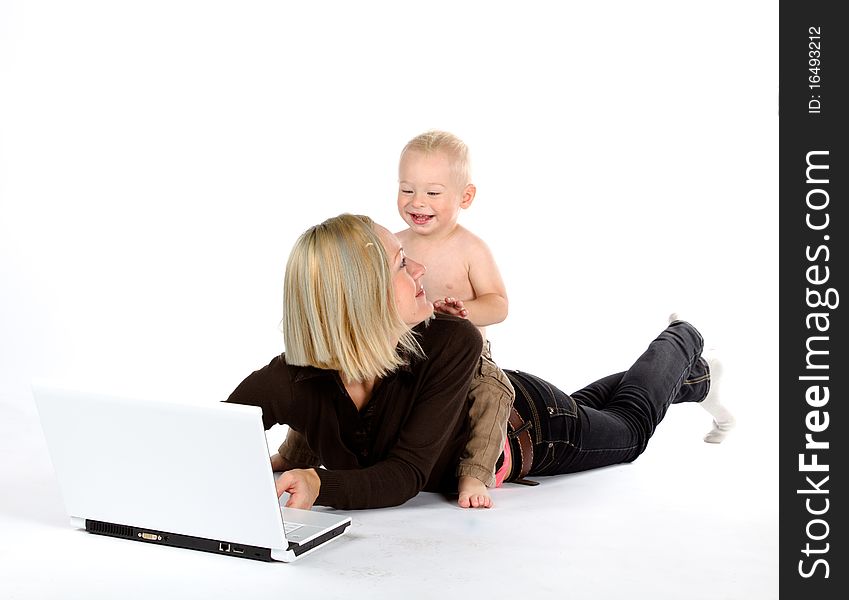 Mother and baby with laptop, isolated on white background. Mother and baby with laptop, isolated on white background