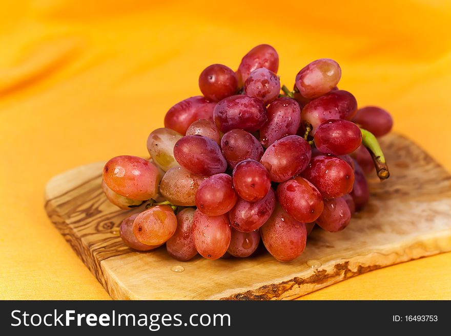 Ripe Red Grape on the Cutting Board.