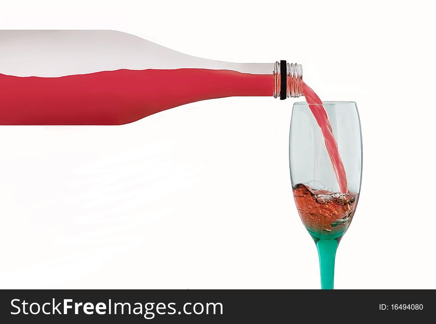 A bottle pours red liquid into a wine glass. A bottle pours red liquid into a wine glass