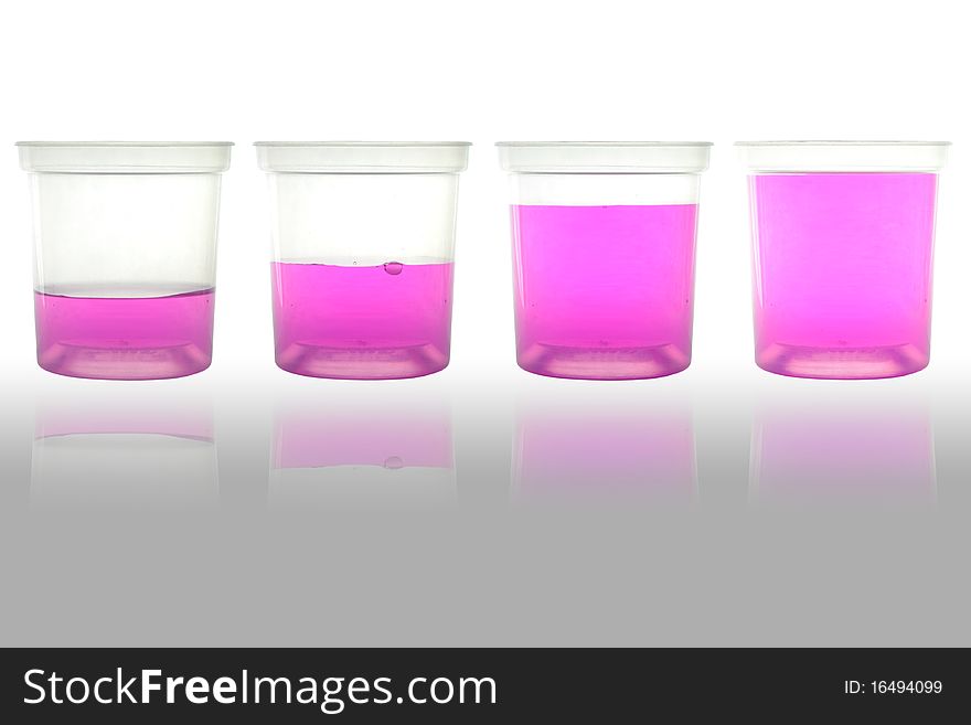 Four cup of pink water for science and drinking. Four cup of pink water for science and drinking.