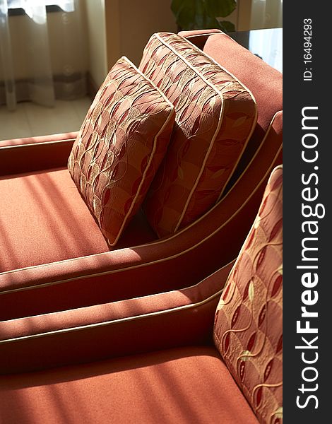 A sun drenched seat in a hotel. A sun drenched seat in a hotel.