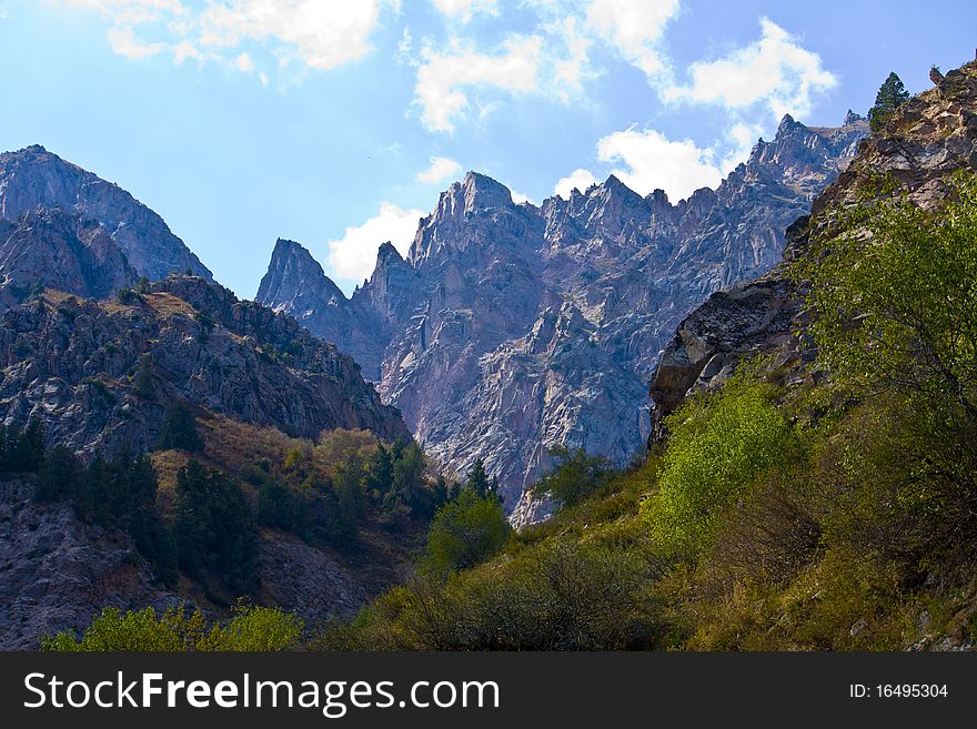 The view from the saddle, the Tien Shan mountain ranges, Central Asia, Uzbekistan, untouched nature. The view from the saddle, the Tien Shan mountain ranges, Central Asia, Uzbekistan, untouched nature