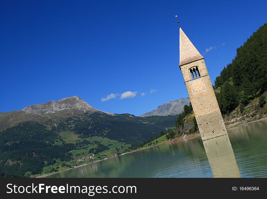 The bell tower is the last remains of Curon Vecchia, destroyed during the construction of the enormous artificial which was built to join the lakes of Curon and Resia, sacrificing a part of the town. The bell tower is the last remains of Curon Vecchia, destroyed during the construction of the enormous artificial which was built to join the lakes of Curon and Resia, sacrificing a part of the town.