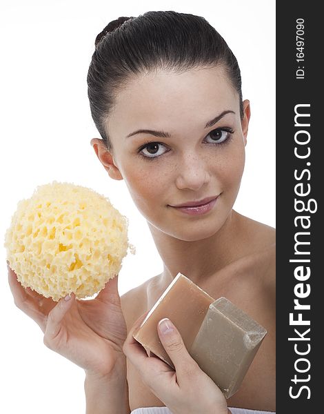 Beautiful young woman with aroma soap and sponge