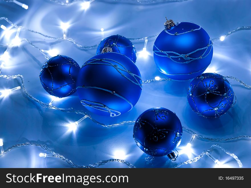 Blue christmas balls with white garland. Blue christmas balls with white garland