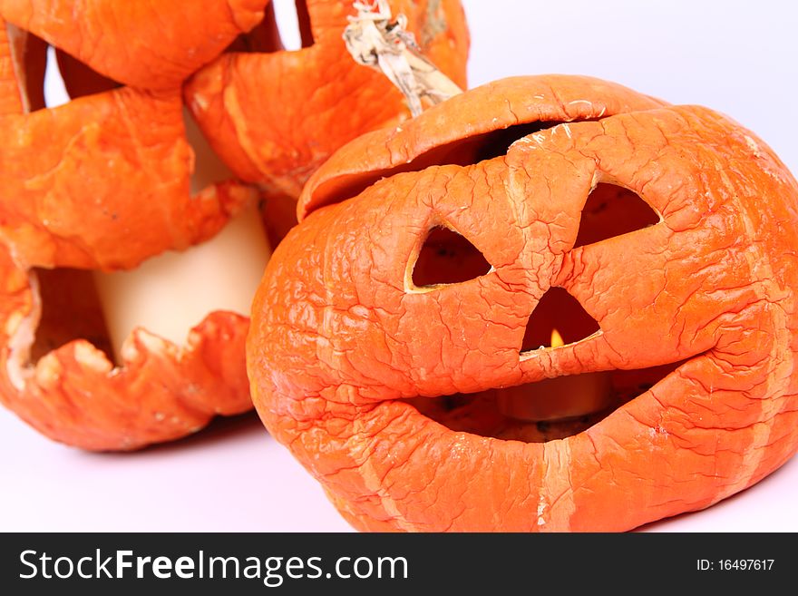 Withered Jack o'lanterns on white background