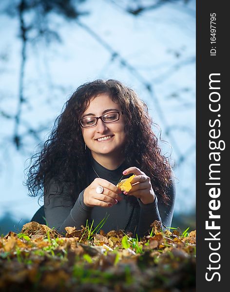 Young woman on autumn grass with evening light. Young woman on autumn grass with evening light