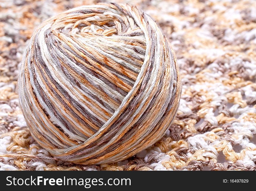 Striped beige tangle of yarn as a background