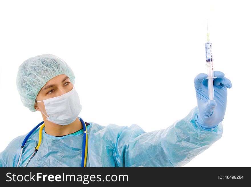 Young male surgeon with a medical syringe, isolated on white