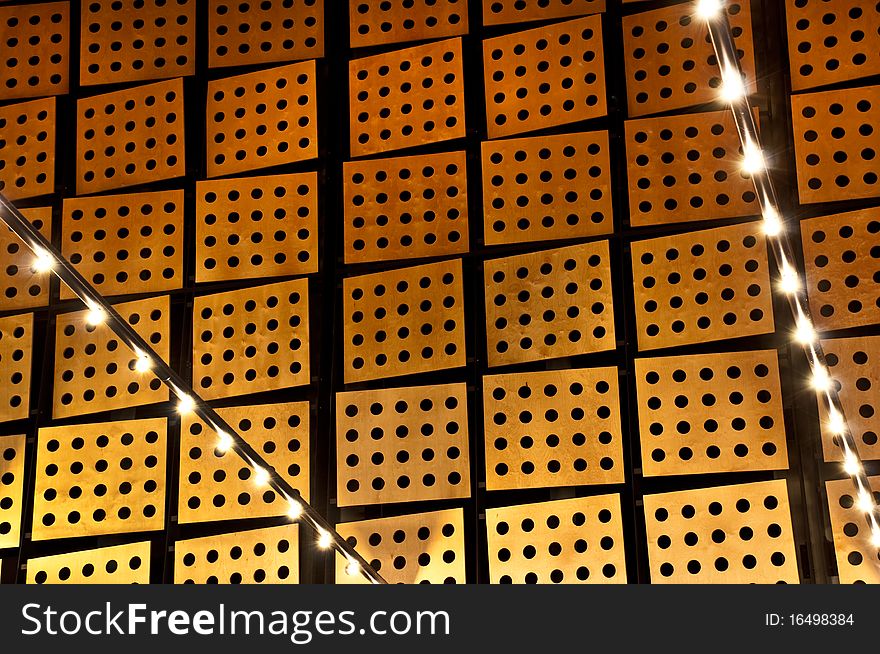 Lights and lightbulbs with a wooden background (acoustic plates)