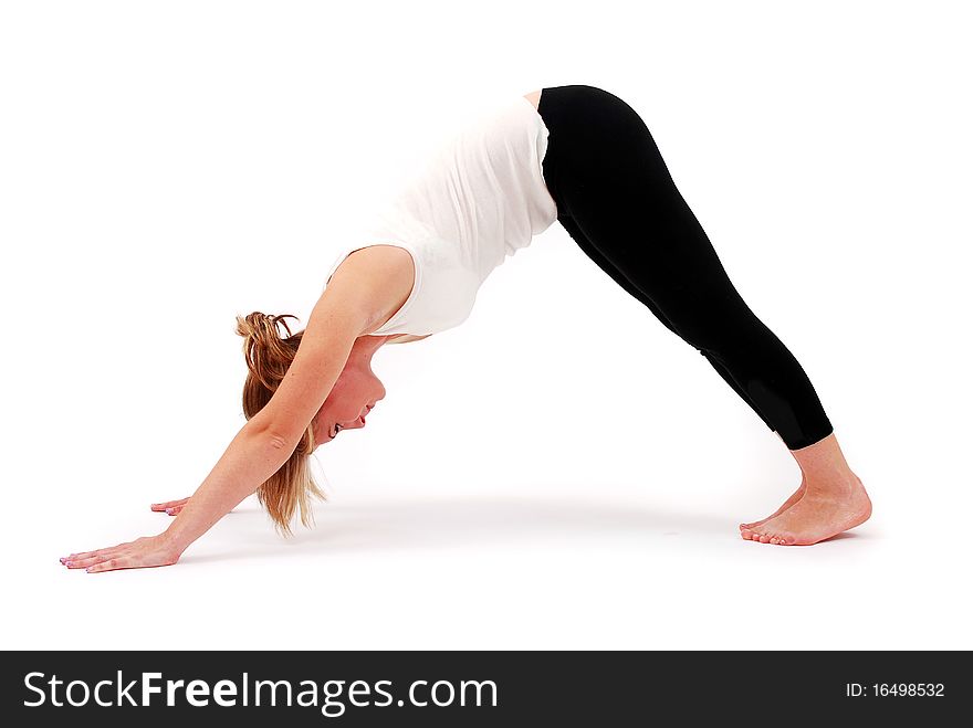 Beautiful girl practicing yoga on isolated white background