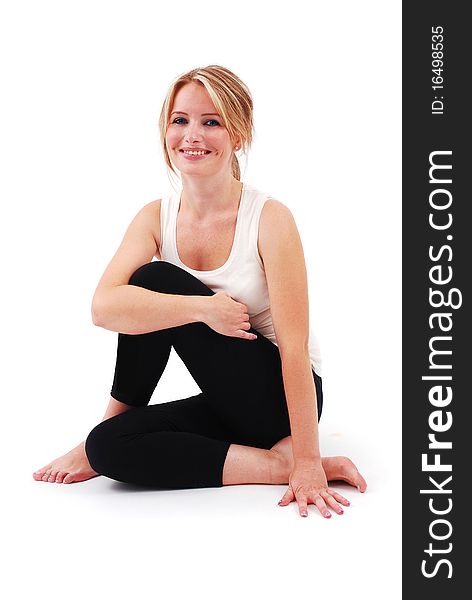 Beautiful girl practicing yoga on isolated white background