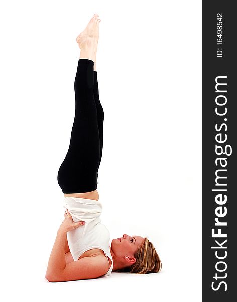 Beautiful girl practicing yoga on isolated white background