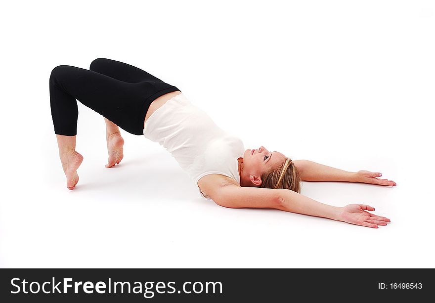 Beautiful girl practicing yoga on isolated white background