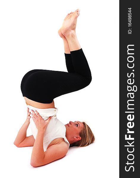 Beautiful girl practicing yoga on isolated white background