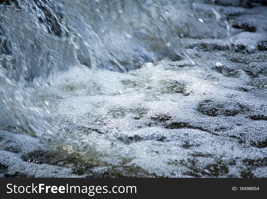 A close up view of a stream of water. A close up view of a stream of water