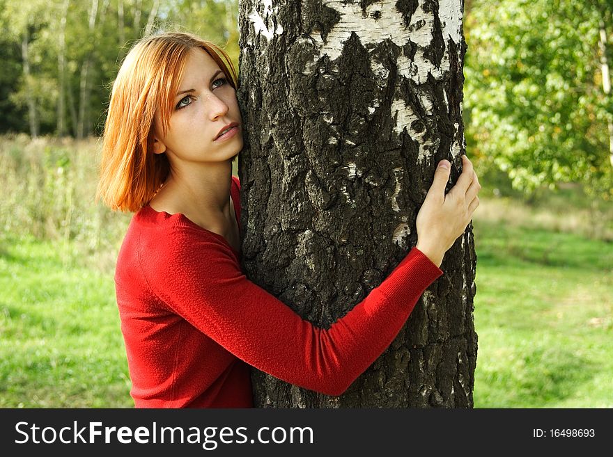 Girl In Red Dress Hug A Tree, Looking At Side