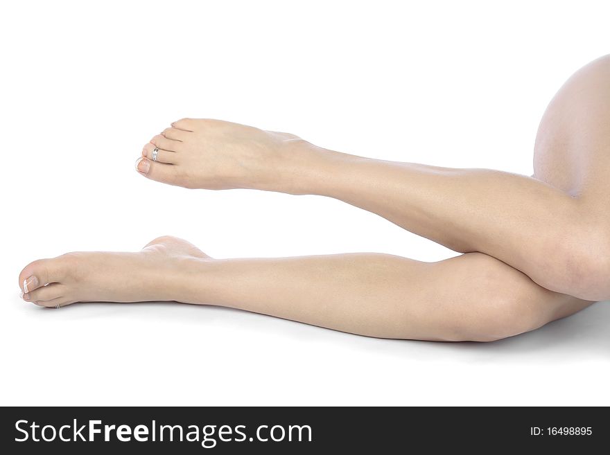 Woman Legs And Feet Isolated Over White