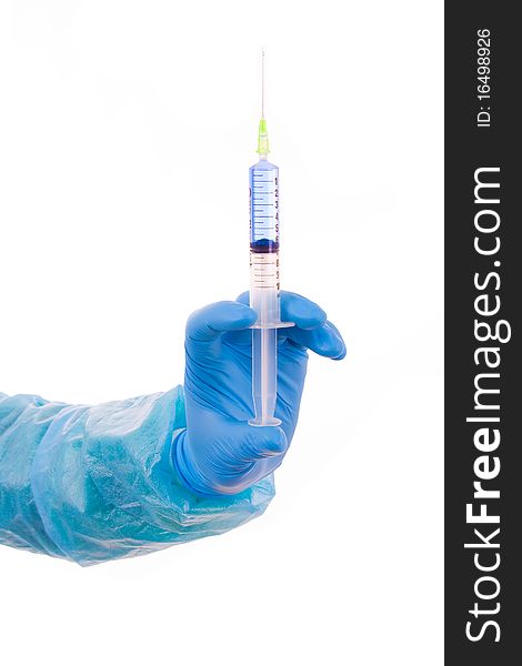 Hand holding a medical syringe. Isolated on white