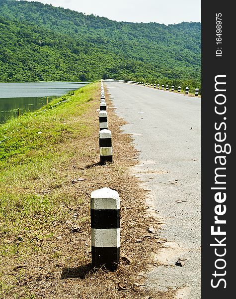 Row of cement poles on the dam