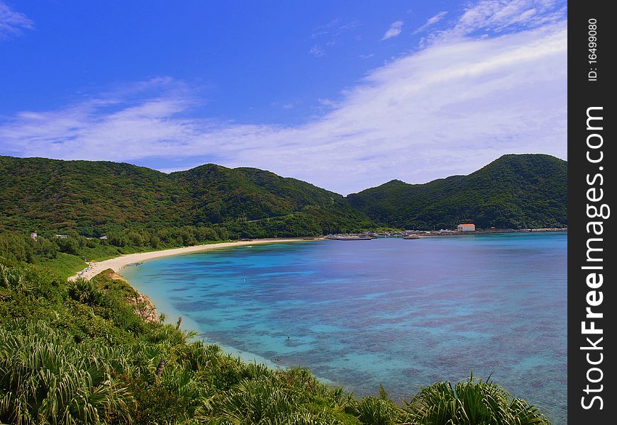 Beautiful beach surrounded by tropical hills on one side and the ocean on the other. Beautiful beach surrounded by tropical hills on one side and the ocean on the other.