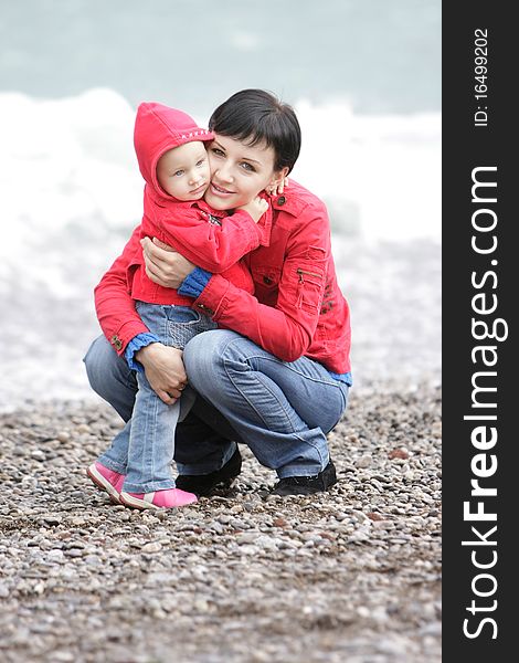 Loving mother and child on sea background