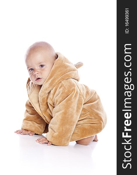 Cute little boy with a warm coat on white background