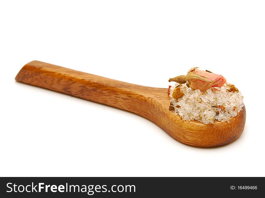 Pile of bath salts on wooden spoon isolated. Pile of bath salts on wooden spoon isolated