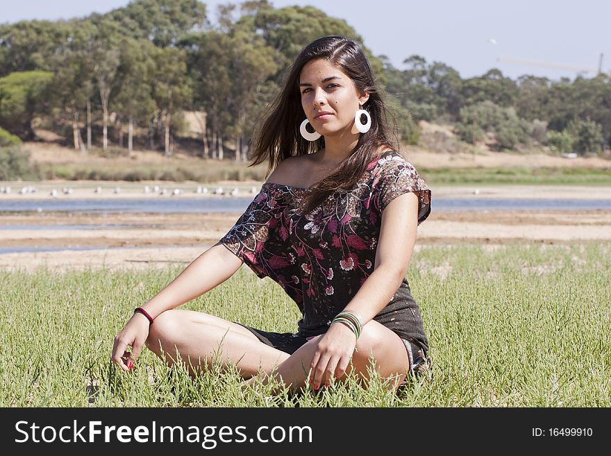 Beautiful girl with floral dress meditating on the nature. Beautiful girl with floral dress meditating on the nature.