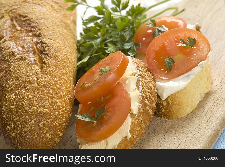 Small sandwich with fresh tomato close up