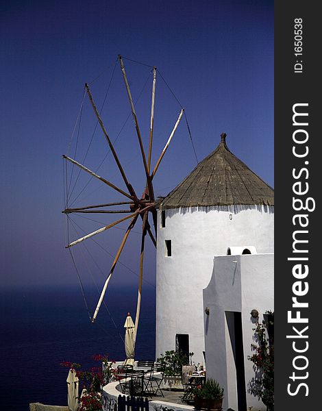 Santorini windmill against the blue sky